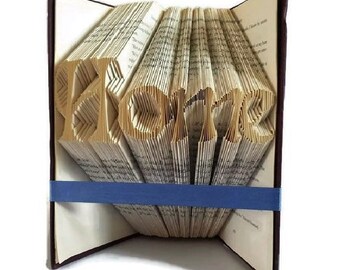 Heimatbuch Faltmuster. Rustikales Einweihungsgeschenk. Handgemachte neue Wohnkultur. Kreieren Sie Ihre eigene Buchskulptur Ornamente. Kostenlose Anleitung