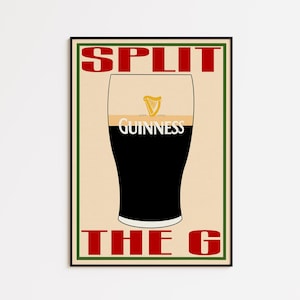 May include: A framed poster featuring a pint of Guinness stout. The glass is filled with dark liquid and topped with a creamy head. The Guinness logo and the words "SPLIT THE G" are in red text.