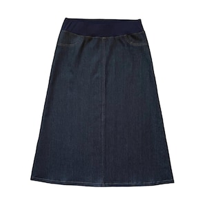 May include: A dark blue denim skirt featuring a wide, solid navy blue elastic waistband. The skirt has an A-line silhouette with a vertical center seam and two faux front pockets, constructed from a deep indigo fabric with subtle stitching details.