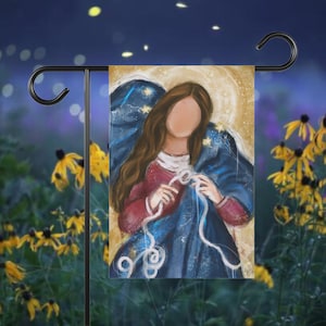 May include: A painting of a woman with long brown hair wearing a blue robe with white stars. She is holding a white rope in her hands and tying a knot. The background is a golden yellow with a halo around her head.