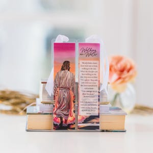 May include: Two-sided bookmark with a colorful image of Jesus walking on water. The bookmark has a white ribbon and the text "Walking on Water" and a Bible verse about Jesus walking on water.