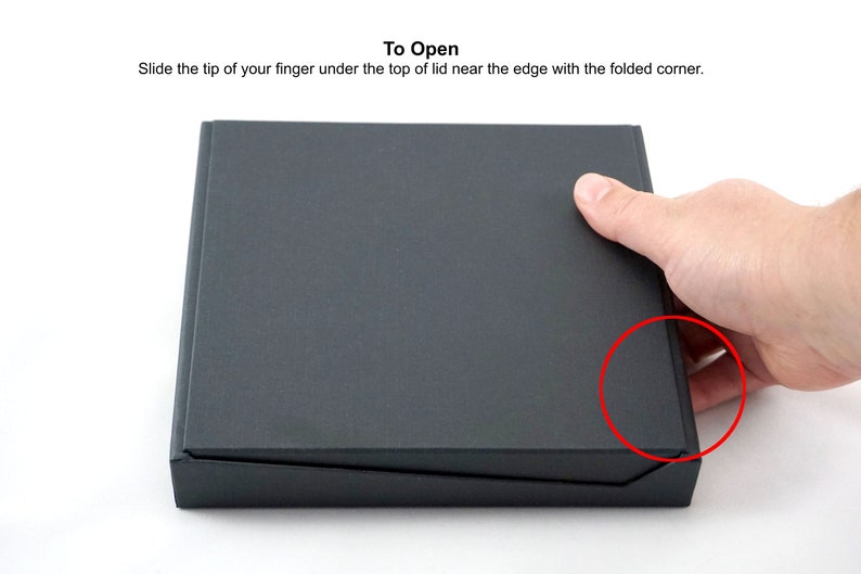 Slide the tip of your finger under the lid near the edge with the folded corner to open.