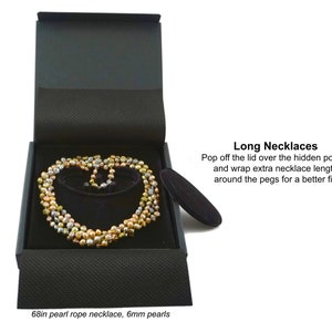 Pop off the lid over the hidden pocket and wrap extra necklace length around the pegs for a better fit.