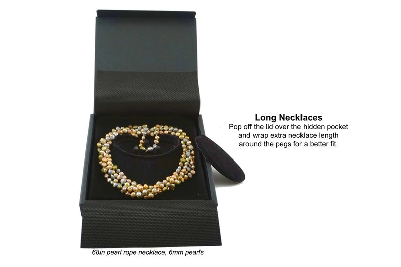 Pop off the lid over the hidden pocket and wrap extra necklace length around the pegs for a better fit.