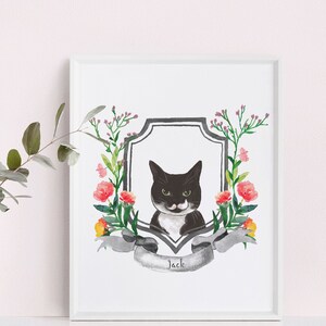 May include: A black and white cat with a white moustache is featured in a watercolour illustration. The cat is surrounded by a wreath of pink, yellow, and green flowers. The illustration is framed in a white frame and the name "Jack" is written on a banner below the cat.