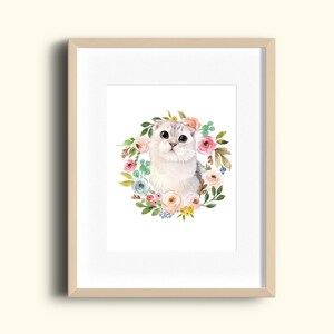May include: A watercolor painting of a white cat with large eyes, surrounded by a wreath of pink, blue, and yellow flowers.
