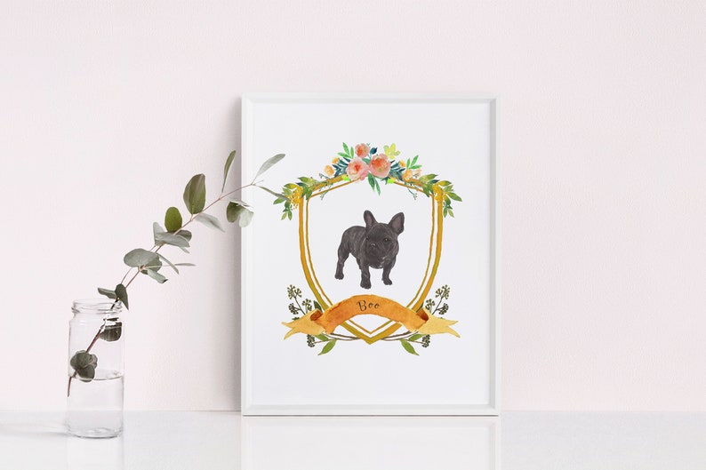 May include: A watercolour illustration of a black French Bulldog in a gold frame with a floral wreath and a banner that says "Boo".