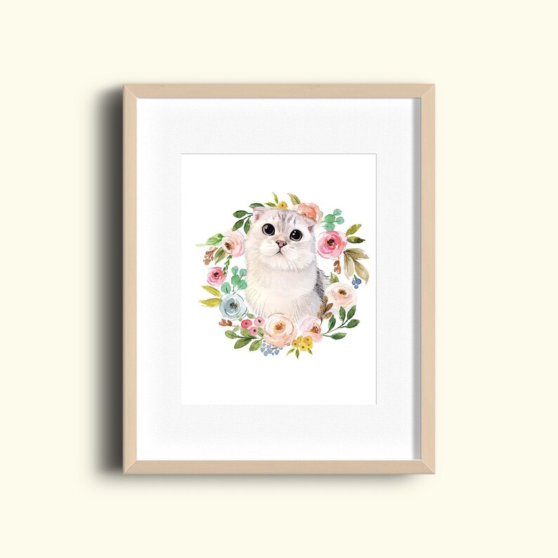 May include: A watercolor painting of a white cat with large eyes, surrounded by a wreath of pink, blue, and yellow flowers.