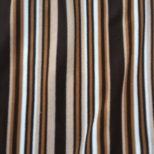 May include: A fabric with vertical stripes in brown, beige, white, and black.