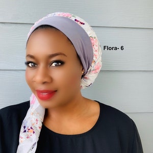 May include: A woman wearing a gray and white floral print satin bonnet with a gray satin lining. The bonnet is tied at the back of her head. The text "Flora-6" is visible in the upper right corner of the image.
