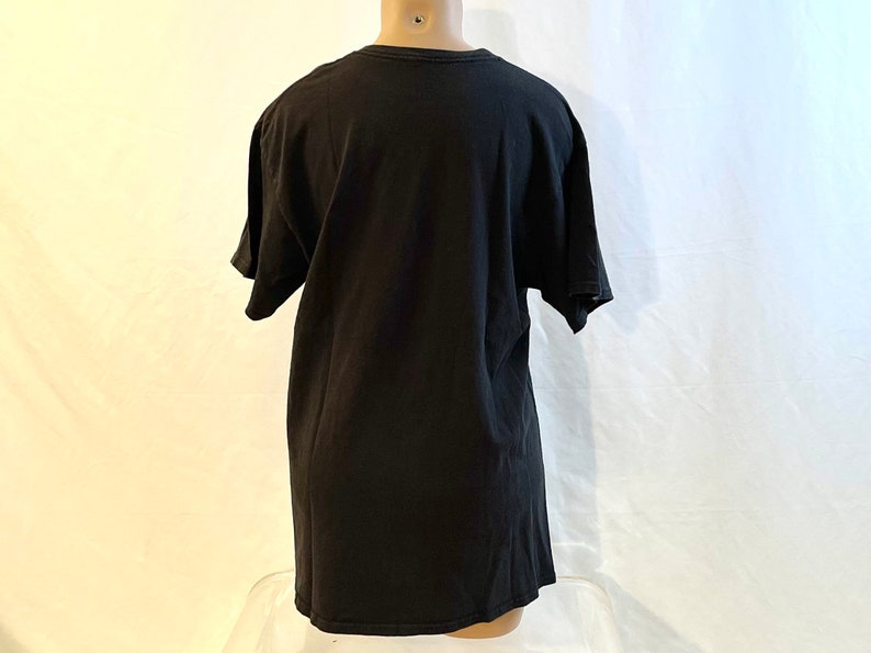 May include: A black short-sleeved t-shirt.