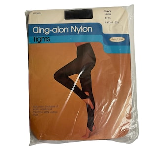May include: Package of black cling-alon nylon tights with a white label that reads "Cling-alon Nylon Tights" and "Navy Large 3>75 137157 016".