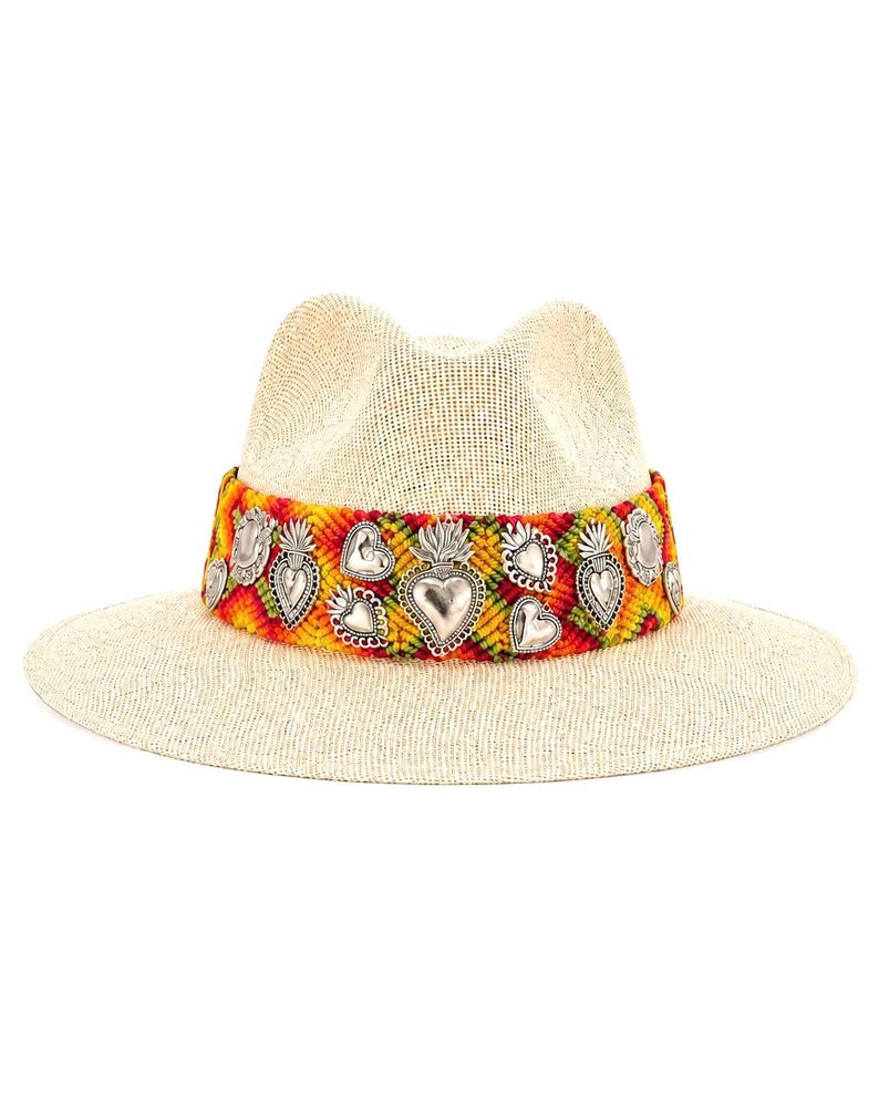 Handmade straw fedora hat for women with colorful Oaxacan knitted band and silver heart charms on white background