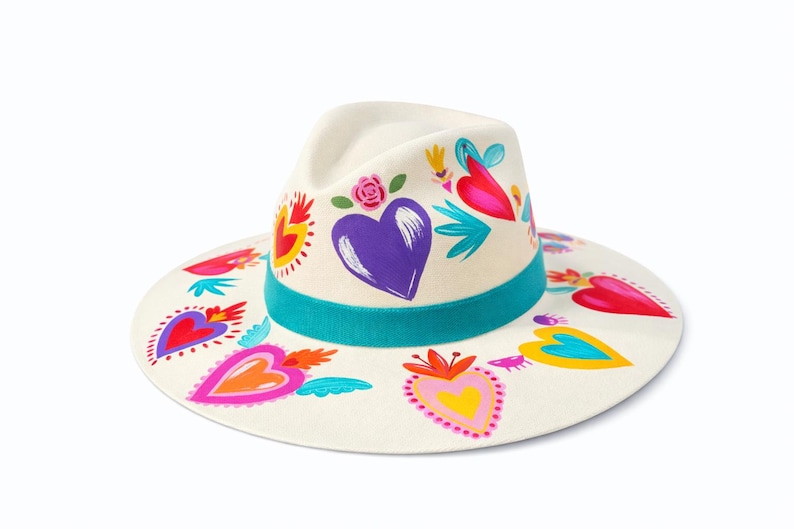Hand painted heart fedora hat made in Mexico with colorful heart designs displayed on white background