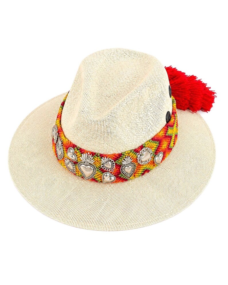 Mexican artisan wide brim straw sun hat with sacred heart charms, red tassel, and colorful knitted band