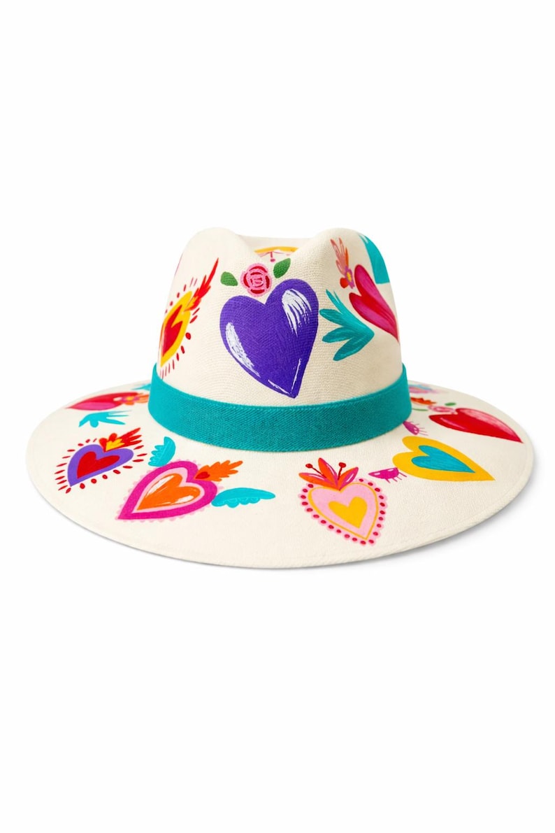 Mexican artisan hand painted fedora hat with hearts all over shown on clean white background by Bootsologie