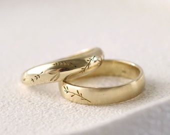 solid gold matching floral wedding rings, His and hers matching leaf engraved rings