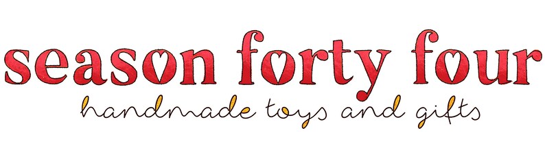 May include: Red text on a white background reads "season forty four handmade toys and gifts".