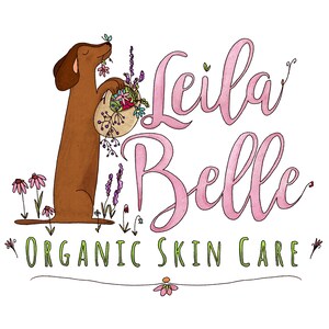 May include: A cartoon illustration of a brown dachshund dog holding a basket of flowers. The text "Leila Belle Organic Skin Care" is written in pink cursive lettering.