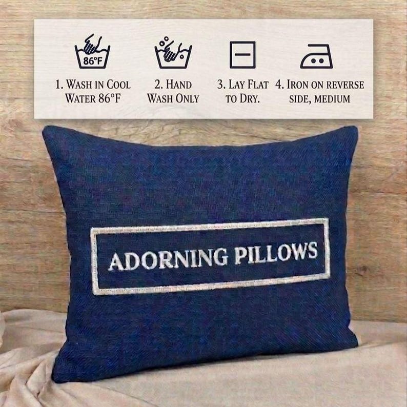 Care instruction infographic for the square red black personalized decorative pillow cover by Adorning Pillows: 1. Wash in cool water 86°F. 2. Hand wash only. 3. Lay flat to dry. 4. Iron on reverse side, medium.