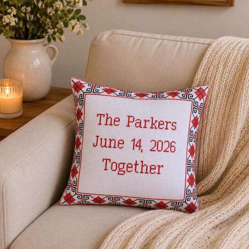 A full view of the square red black personalized decorative pillow in a modern farmhouse living room, showing how it enhances the space.