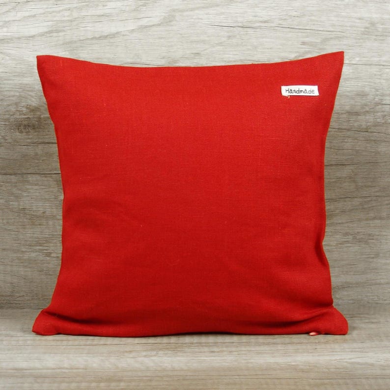 Clean reverse side of the handmade square red black personalized decorative pillow cover, demonstrating quality workmanship and fabric consistency throughout.
