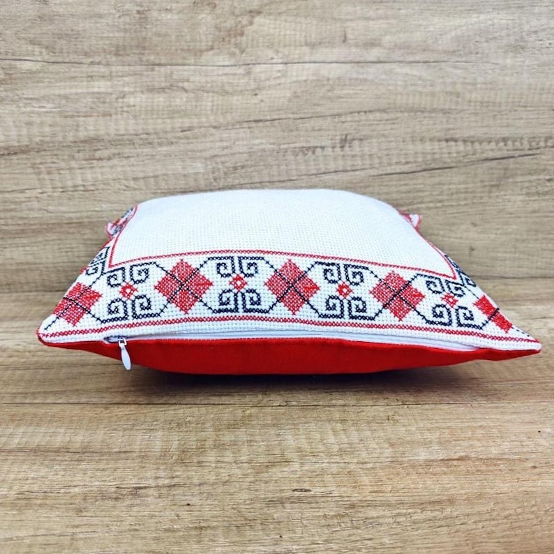 Side-profile image of the square red black personalized decorative pillow cover, showing its full-bodied shape and durable construction.