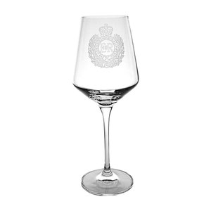 May include: A clear glass wine glass with a stem and a wide bowl. The glass is etched with the Royal Coat of Arms of the United Kingdom, featuring a crown, the letters "ER", and a wreath of leaves.