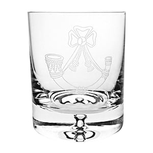 May include: A clear glass tumbler with an etched design of a bugle, a bow, and a knot. The glass has a thick base.