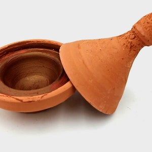 Aker el fassi. Traditional Berber lipstick in a ceramic tagine.
