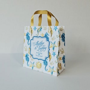 Sacchetti di benvenuto per matrimonio con design a cavalluccio marino e conchiglie. Completamente personalizzabili. Sacchetti ecologici. Sacchetti per hotel per gli ospiti. Sacchetti di carta. Sacchetti per bomboniere. Bomboniere.