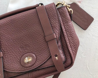 Coach maroon cross body bag with metal details