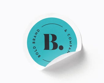 May include: A turquoise round sticker with a white border and the text "BOLD BRAND & COMPANY" in a circle around the letter "B." in black.