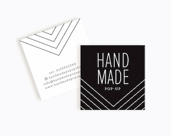 May include: Black and white business card with the text "HAND MADE POP-UP" and a geometric pattern. The back of the card has contact information including a phone number, email address, and website.
