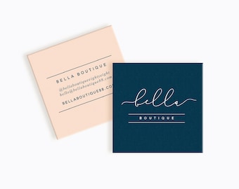 May include: Two business cards with a navy blue background and white text. The top card has a peach background and the text "BELLA BOUTIQUE" with contact information. The bottom card has the text "bella BOUTIQUE" in a cursive font.