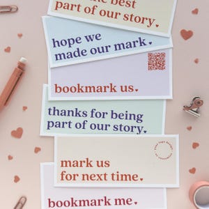 May include: A set of colorful bookmarks with different messages, including "part of our story", "hope we made our mark", "bookmark us", "thanks for being part of our story", "mark us for next time", and "bookmark me".