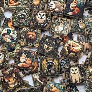 May include: A collection of square wooden tiles featuring various forest animals such as owls, foxes, and bears. Each tile has a detailed illustration with a vintage aesthetic, surrounded by floral and leaf borders. The color palette includes greens, browns, and creams.