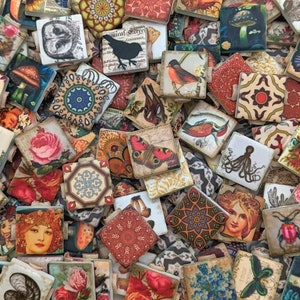 May include: A collection of colorful, patterned ceramic tiles featuring various designs, including butterflies, flowers, birds, and geometric shapes. The tiles are arranged in a random pattern, creating a visually appealing mosaic.
