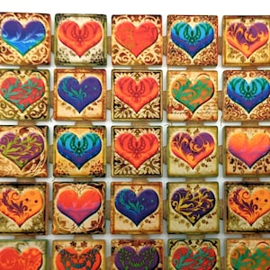 May include: A set of 36 square tiles with a heart design. Each tile features a different color and pattern of hearts, including red, orange, yellow, green, blue, purple, and brown. The tiles are made of ceramic and have a glossy finish.
