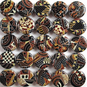 May include: Twenty-five round, black and brown ceramic tiles with geometric patterns. Each tile has a different design.