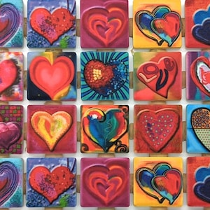 May include: A collection of 20 colorful heart-shaped tiles with various designs and patterns. The tiles are arranged in a grid pattern and are made of ceramic.