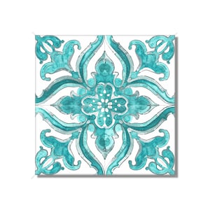 May include: A square tile with a teal and white intricate floral pattern. The design is symmetrical and features a central flower with four petals.