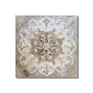 May include: Square wall art featuring a detailed, raised floral design. The artwork showcases a central flower with surrounding ornate patterns in shades of gold and cream, set against a textured, neutral background. A decorative piece for home decor.