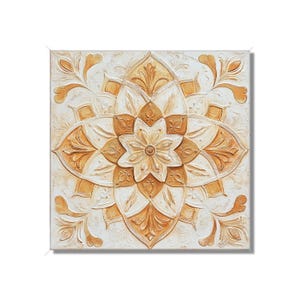 May include: A white canvas painting with a gold and white mandala design. The mandala is a geometric pattern with intricate details.