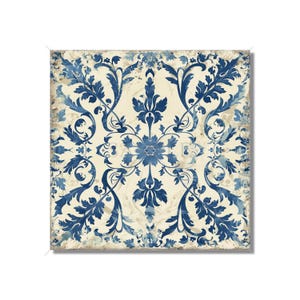 May include: A square tile with a blue and white floral pattern. The tile has a distressed, vintage look.