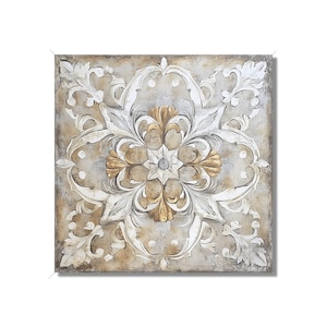 May include: Square wall art featuring a detailed, raised floral design. The artwork has a neutral color palette with gold, white, and beige tones. The central floral element is gold, surrounded by white and beige scrollwork.