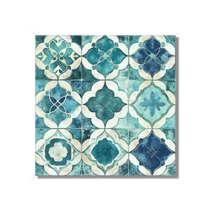 May include: A square wall art piece featuring a grid of nine tiles with a repeating quatrefoil pattern. The design displays various shades of teal, navy blue, and off-white, with a distressed, weathered texture across the surface of each tile.