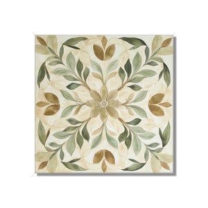 May include: A square, cream-colored canvas with a symmetrical design of green leaves and brown flower shapes. The design is centered and creates a repeating pattern.