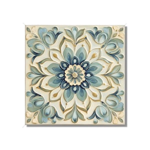 May include: A square canvas painting with a blue and gold floral design. The center of the painting features a large blue flower with gold accents. The background is a light cream color.