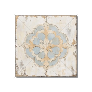 May include: A square tile with a distressed white background and a blue and beige floral pattern in the center.